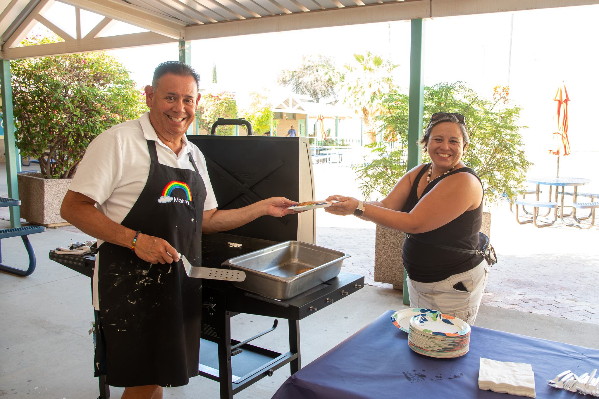 Man and woam at grill